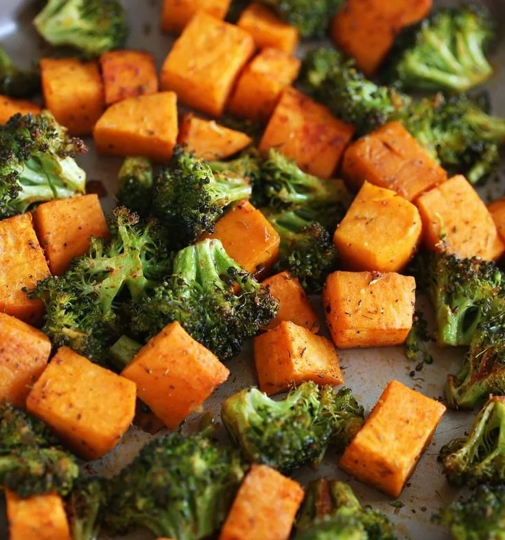 Perfectly roasted broccoli and sweet potatoes on a serving platter