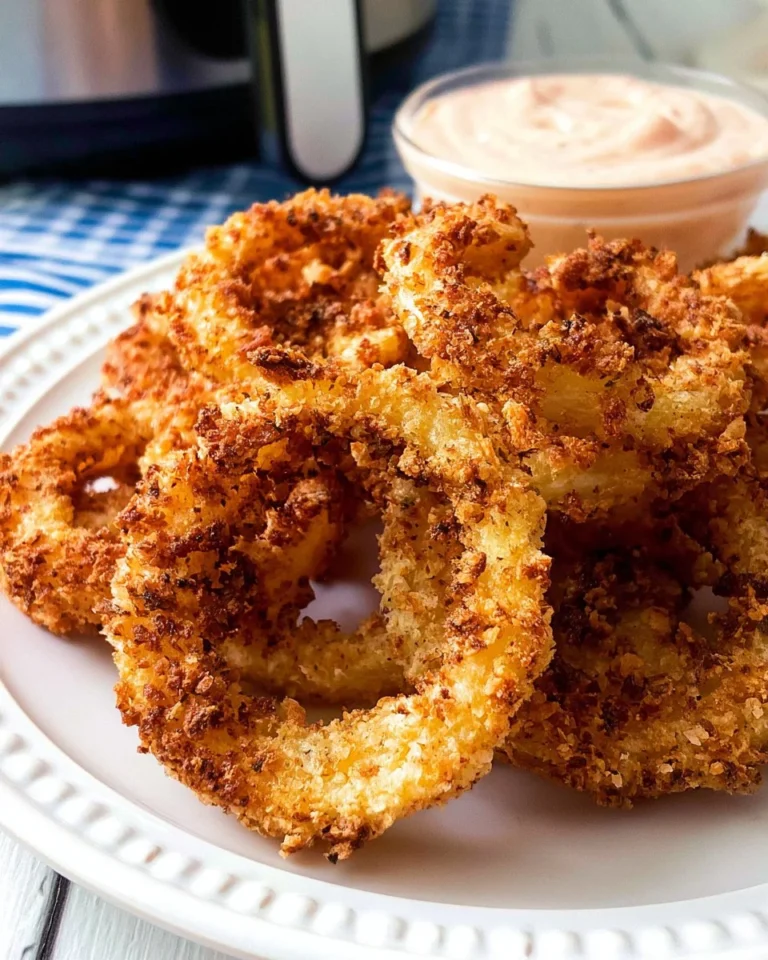 Crispy air fryer onion rings served on a plate