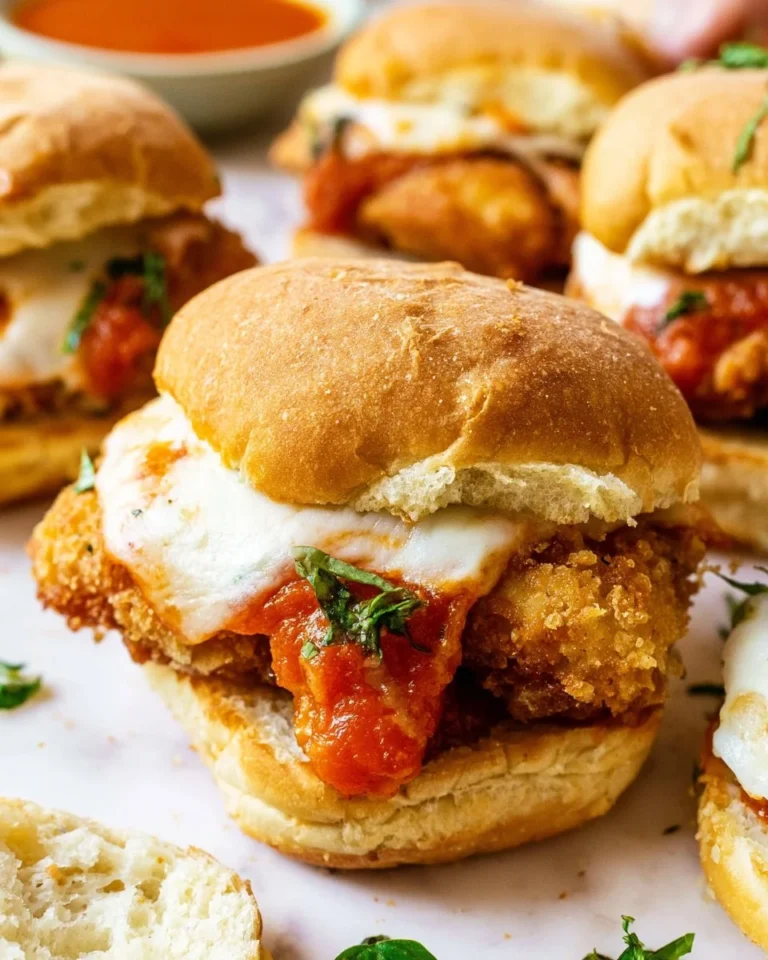 Delicious air-fried crispy chicken parm sliders served on a platter.