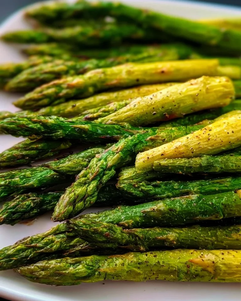 Golden air fryer asparagus cooked to perfection in an air fryer.